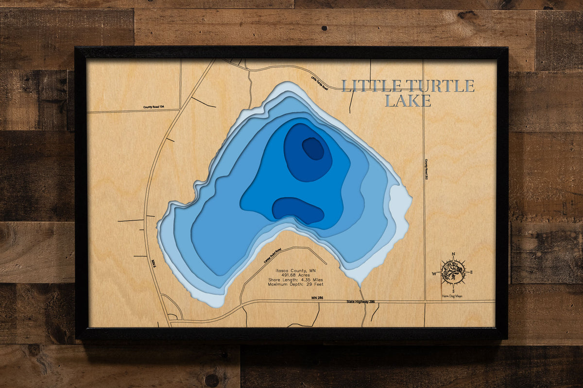 A precision laser-cut, multi-layered wooden map of Little Turtle Lake in Itasca County, Minnesota, a 492-acre Northwoods lake near Talmoon in the Big Fork River watershed with a diverse fishery including Tullibee, Walleye, and Bass. The natural wood top layer captures 4 miles of forested shoreline in fine detail, while a light-to-dark blue gradient conveys the lake's 29-foot depth. A handcrafted statement piece for any Minnesota lake cabin, home, or outdoor enthusiast's wall.