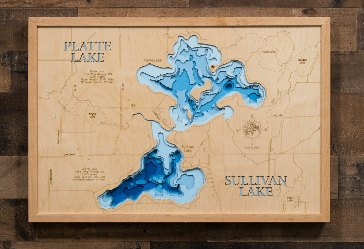 A laser-cut, layered wooden map of Platte and Sullivan Lakes in Crow Wing County, Minnesota. The distinct shapes of the two interconnected lakes, and the Platte River channel that joins them, are clearly visible within the forested landscape of central Minnesota. The varying depths of the lakes, reaching a maximum of 57 feet, are represented by different layers of wood, illustrating their impressive underwater topographies.