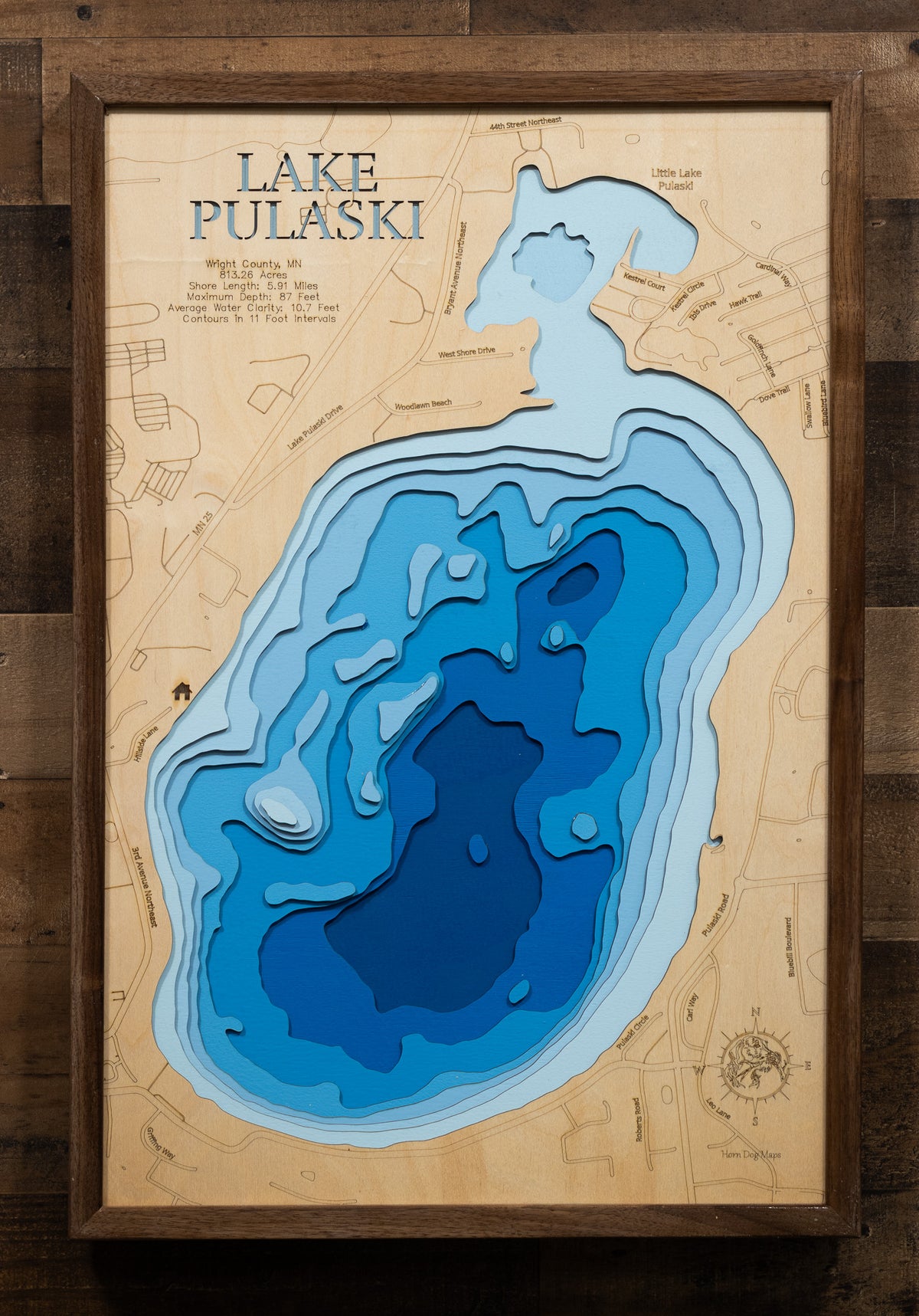 Laser-engraved relief map of Lake Pulaski in Wright County, MN, crafted from wood with high precision.
