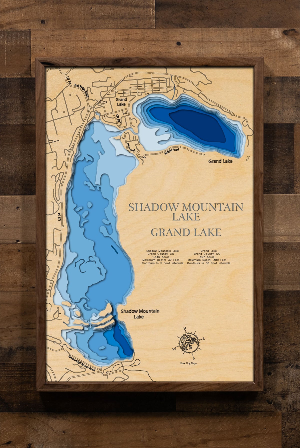 A laser-cut, layered wood map of Shadow Mountain Lake and Grand Lake, Colorado, highlighting their interconnected shorelines and surrounding mountainous terrain.