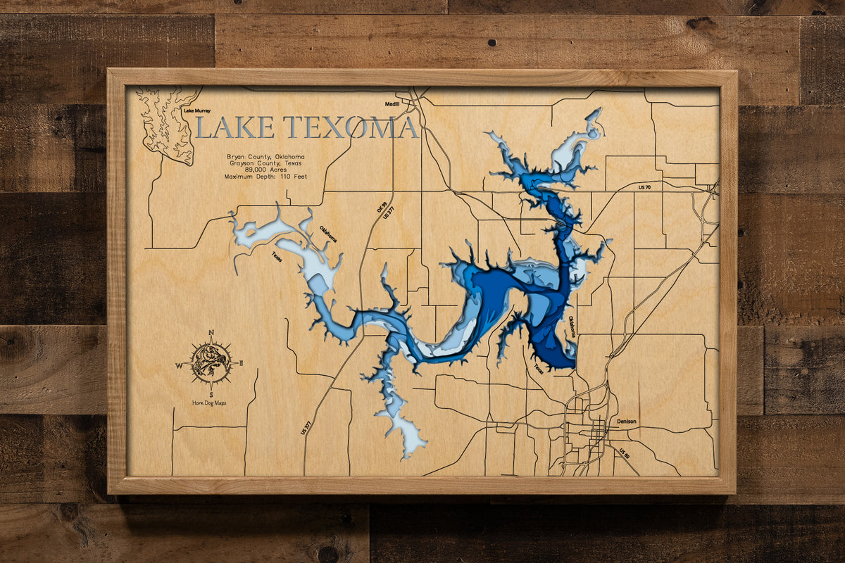 An intricately detailed, laser-cut, multi-layered wooden map of Lake Texoma spanning the Oklahoma-Texas border. The map showcases the reservoir's massive 89,000-acre expanse, depth contours revealing the 100-foot maximum depth near Denison Dam, the distinctive 580 miles of serpentine shoreline, and the confluence of the Red and Washita Rivers.