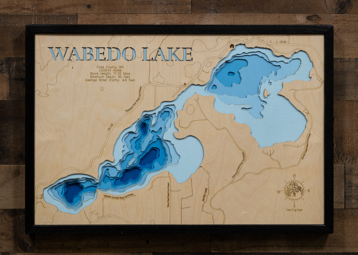 Detailed wooden relief map of Wabedo Lake in Cass County, MN, showcasing its natural beauty.