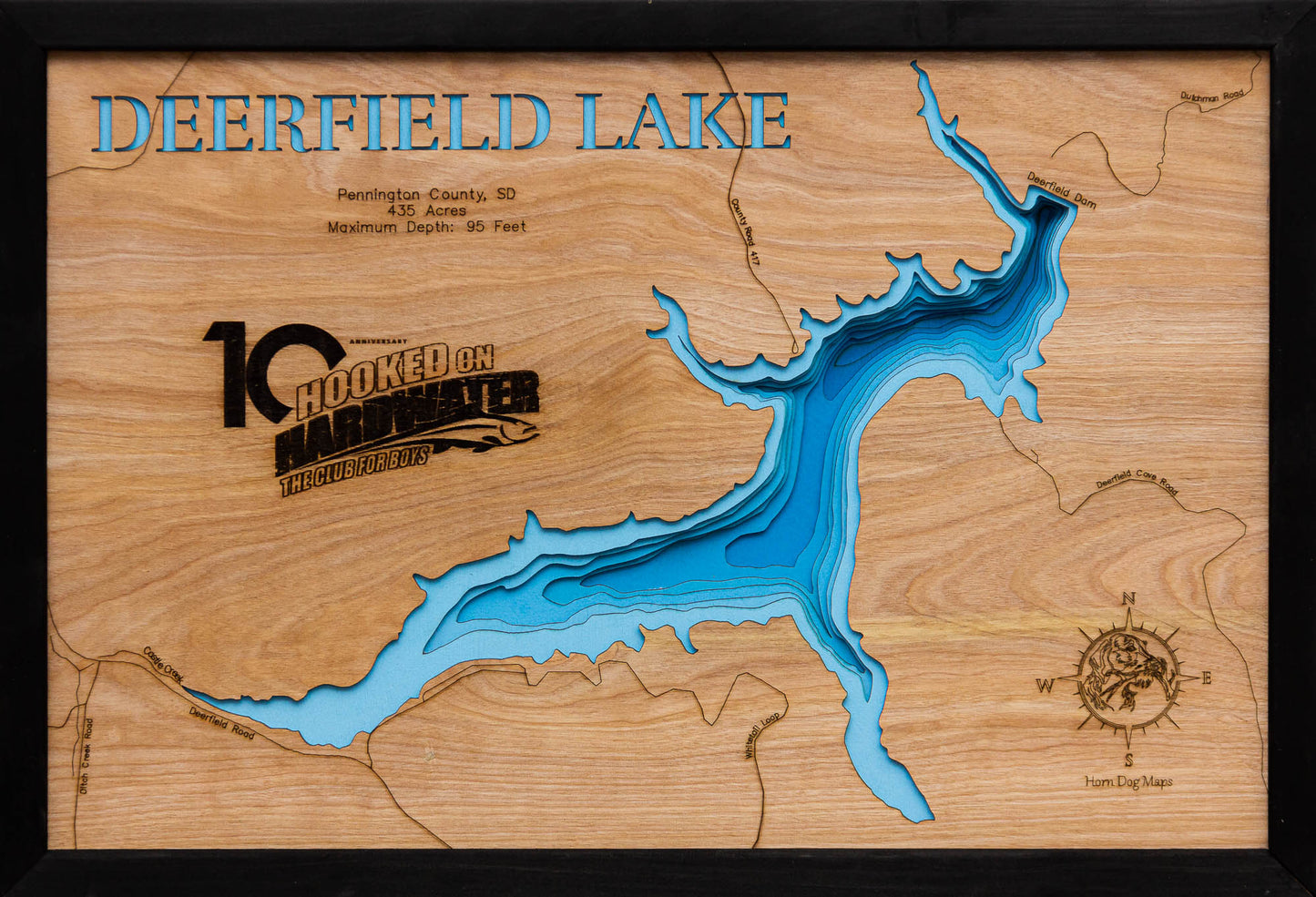 3D wooden lake map of Deerfield Lake in Pennington County, SD, showcasing detailed depth layers and contours.