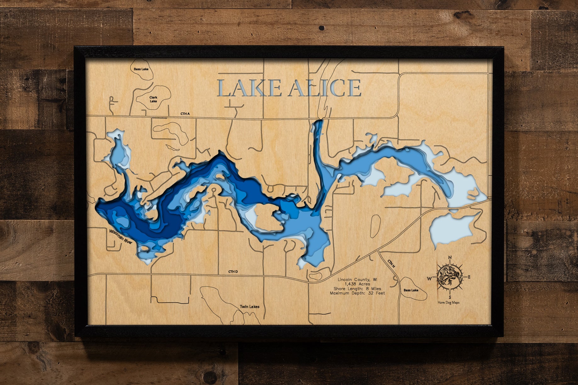 A highly detailed, laser-cut, and multi-layered wooden map of Lake Alice in Lincoln County, Wisconsin. The map showcases the lake's expansive 1,438-acre flowage created by the historic 1911 King's Dam, depth contours reaching 32 feet, the distinctive stump fields and submerged logs creating unique underwater habitat, and 8 miles of irregular shoreline along the Wisconsin River corridor.