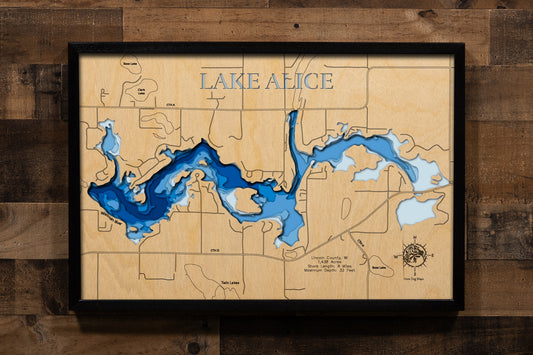 A highly detailed, laser-cut, and multi-layered wooden map of Lake Alice in Lincoln County, Wisconsin. The map showcases the lake's expansive 1,438-acre flowage created by the historic 1911 King's Dam, depth contours reaching 32 feet, the distinctive stump fields and submerged logs creating unique underwater habitat, and 8 miles of irregular shoreline along the Wisconsin River corridor.