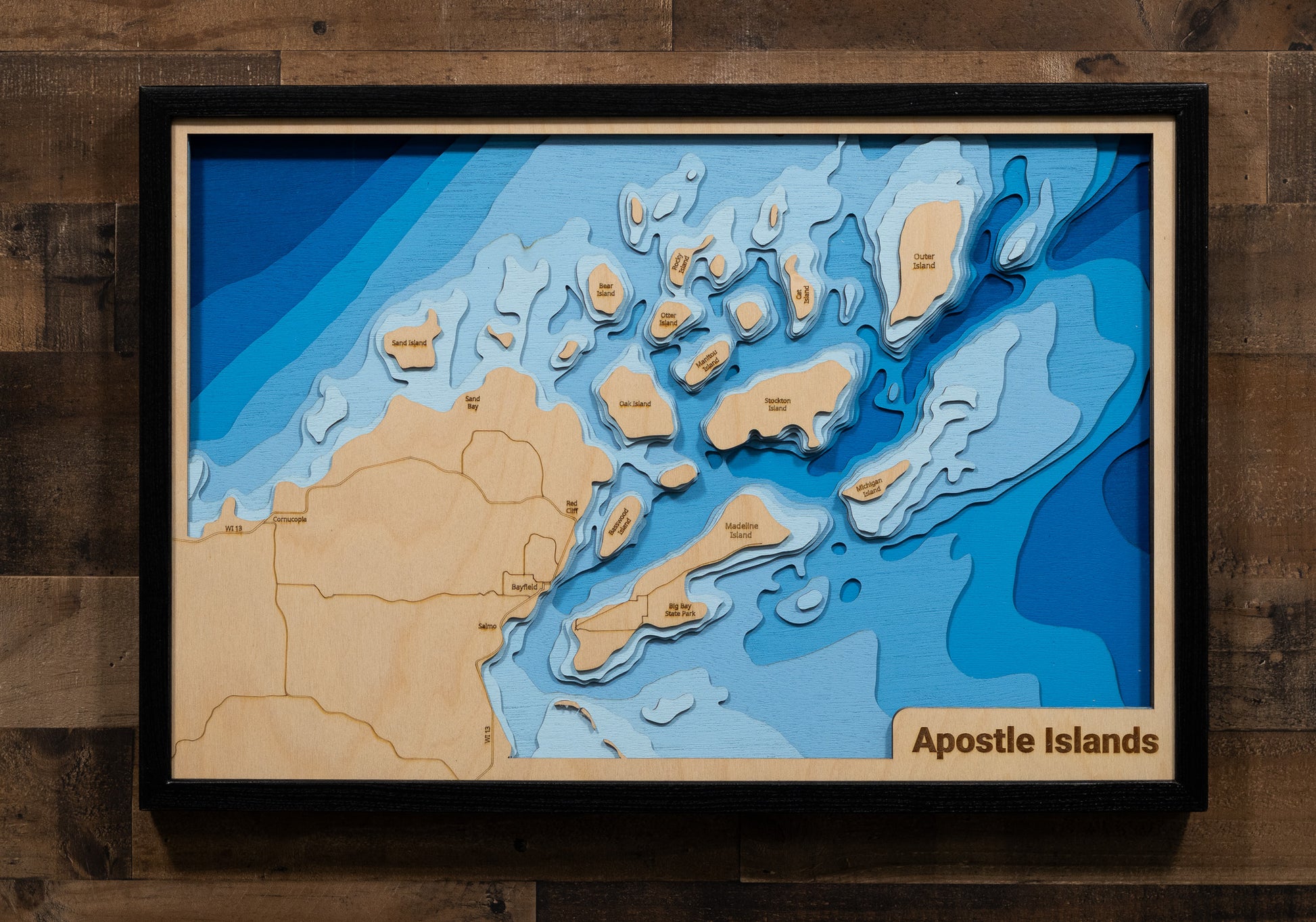 3D wooden lake map of Apostle Islands and Chequamegon Bay on Lake Superior, showcasing detailed depth layers and contours.