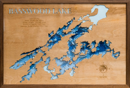 Custom wooden map of Basswood Lake in Lake County, MN and Ontario, Canada with layered depth highlights.