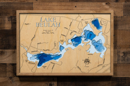 A precision laser-cut, multi-layered wooden map of Lake Beulah in Walworth County, Wisconsin, an 812-acre mesotrophic lake near East Troy earning an EPA water quality grade of A (Excellent) with 15 miles of shoreline and a maximum depth of 58 feet. The natural wood top layer captures every cove and bay in fine detail, while a light-to-dark blue gradient conveys the lake's impressive depth and clarity. A handcrafted statement piece for any Wisconsin lake home, cabin, or outdoor enthusiast's wall.