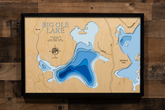 A precision laser-cut, multi-layered wooden map of Big Ole Lake in Itasca County, Minnesota, located near Marcell in the heart of the Northwoods. The natural wood top layer captures 5 miles of forested shoreline in fine detail, while a light-to-dark blue gradient conveys the lake's 65-foot depth. A handcrafted statement piece for any Minnesota cabin, lake home, or outdoor enthusiast's wall.