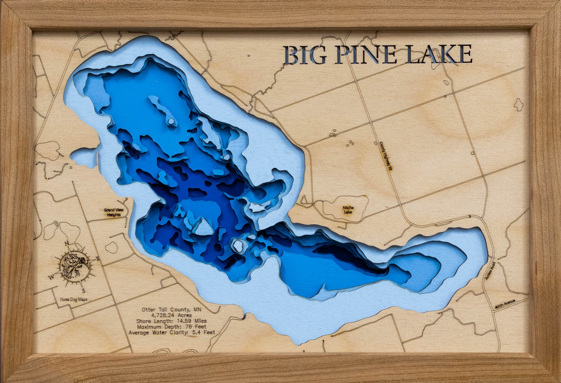 Laser-engraved relief map of 3d Depth map of Big Pine Lake in Otter Tail County, MN, crafted from wood with high precision.