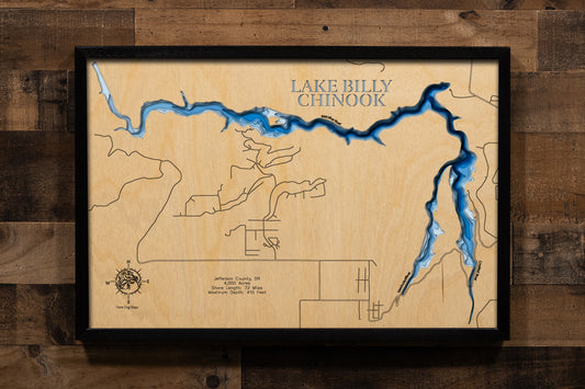 An exquisitely detailed, laser-cut, multi-layered wooden map of Lake Billy Chinook in Jefferson County, Oregon. The map displays the reservoir's 4,000-acre surface carved into dramatic canyons, depth contours showing the 415-foot maximum depth near Round Butte Dam, the three distinct arms formed by the Crooked, Deschutes, and Metolius rivers, and 72 miles of shoreline.