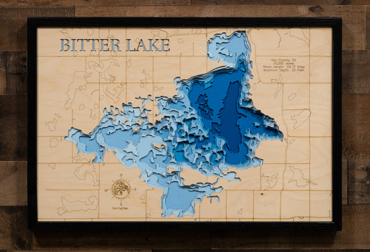 Wooden map of Bitter Lake with blue water features on a wooden background