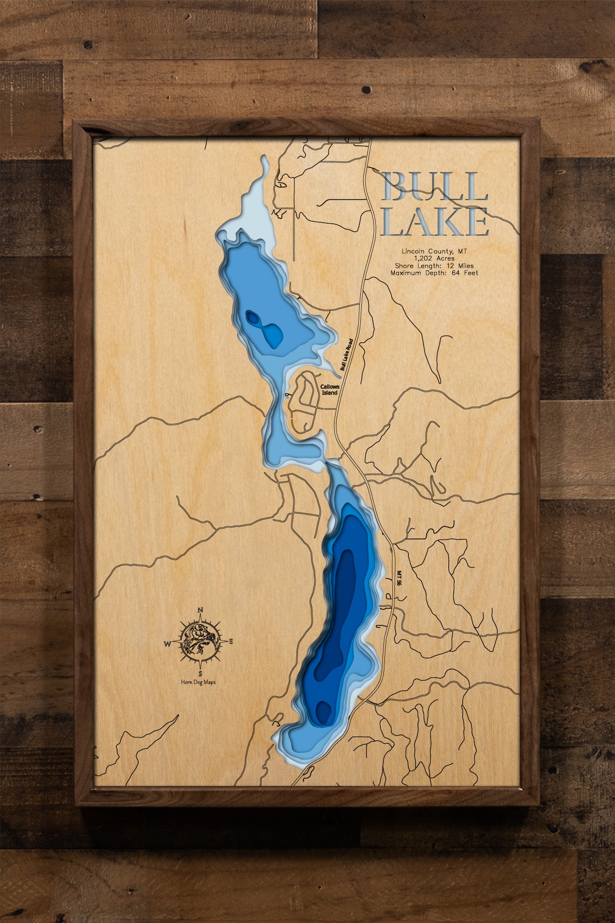 County, Montana, nestled in the Cabinet Mountains foothills, showcasing the 1,202-acre pristine mountain lake's 12 miles of forested shoreline, depth contours revealing the 64-foot maximum depth, and Montana Highway 56 running along the eastern shore.