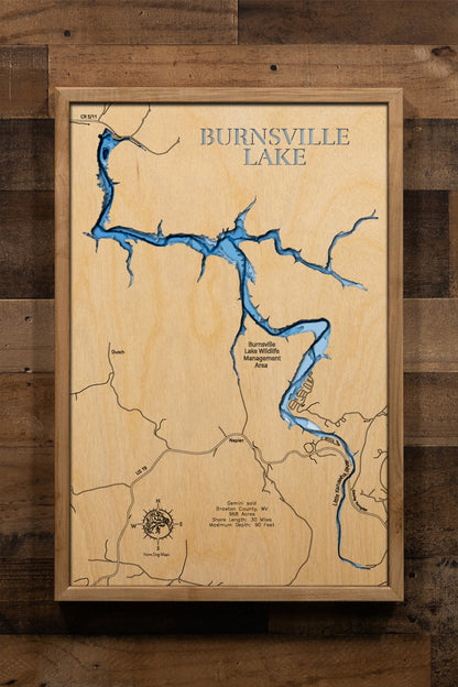 A precision laser-cut wooden map of Burnsville Lake, West Virginia, 
featuring a natural wood top layer and a multi-level blue gradient 
for the water. The 3D topographic design highlights the 30-mile 
shoreline and 90-foot depth in a sophisticated art piece. It is a 
rustic yet modern home decor item that perfectly captures the 
unique shape of this Braxton County reservoir for any cabin wall.