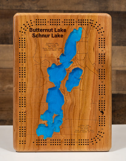 Artisanally carved wooden lake map of Butternut Lake and Schnur Lake in Price County, WI, highlighting bathymetry.