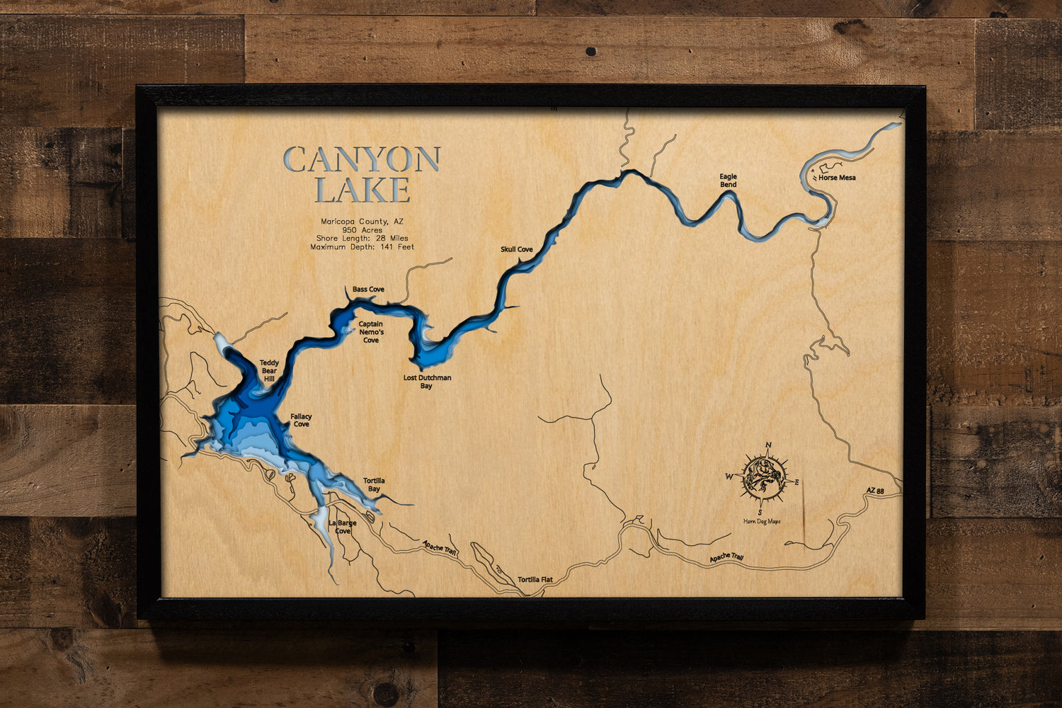 A precision laser-cut, multi-layered wooden map of Canyon Lake in Maricopa County, Arizona. The natural wood top layer captures 28 miles of dramatic, cliff-lined Salt River canyon shoreline in fine detail, while a light-to-dark blue gradient conveys the reservoir's striking 141-foot depth. A handcrafted statement piece for any Arizona lake home, desert retreat, or Southwest enthusiast's wall.
