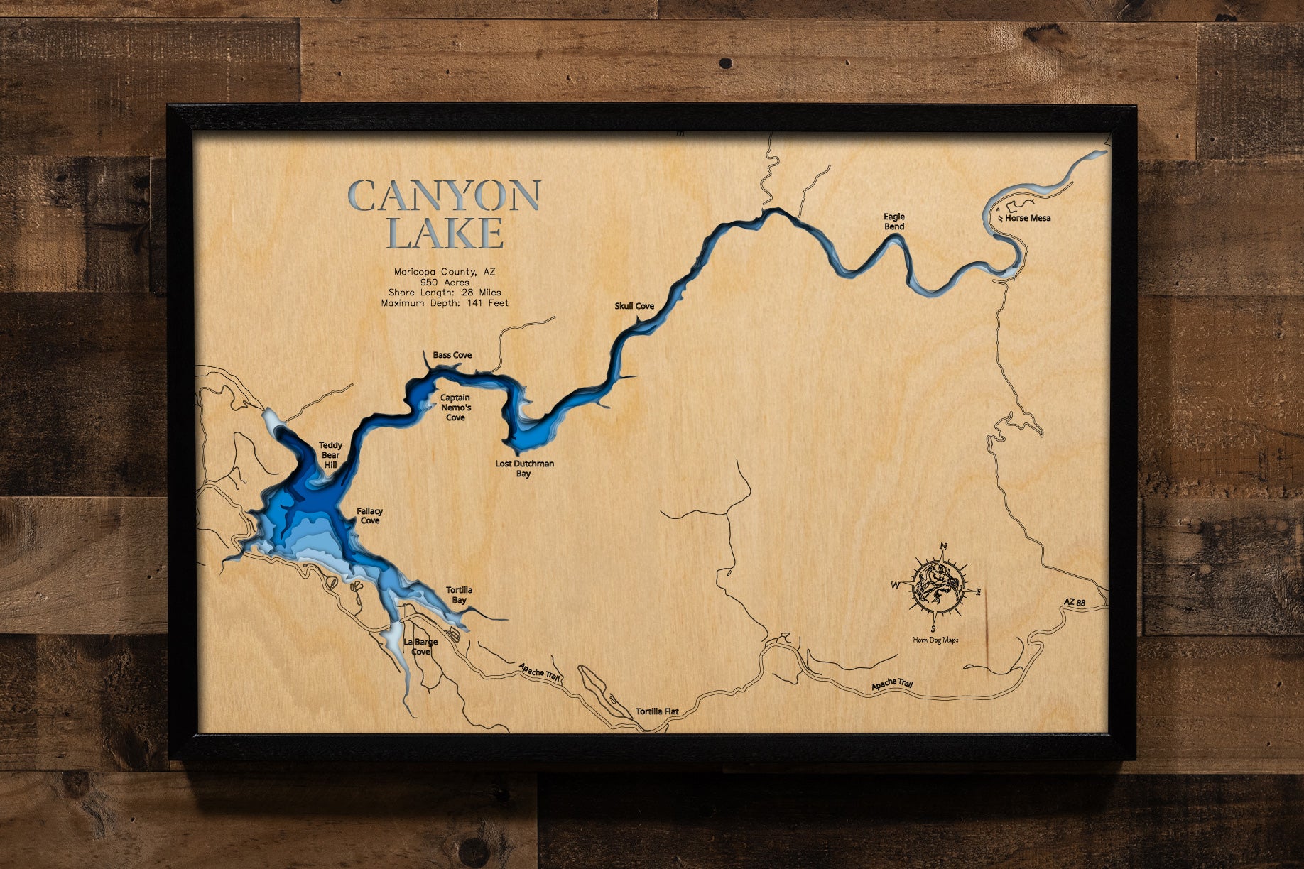 A precision laser-cut, multi-layered wooden map of Canyon Lake in Maricopa County, Arizona. The natural wood top layer captures 28 miles of dramatic, cliff-lined Salt River canyon shoreline in fine detail, while a light-to-dark blue gradient conveys the reservoir's striking 141-foot depth. A handcrafted statement piece for any Arizona lake home, desert retreat, or Southwest enthusiast's wall.