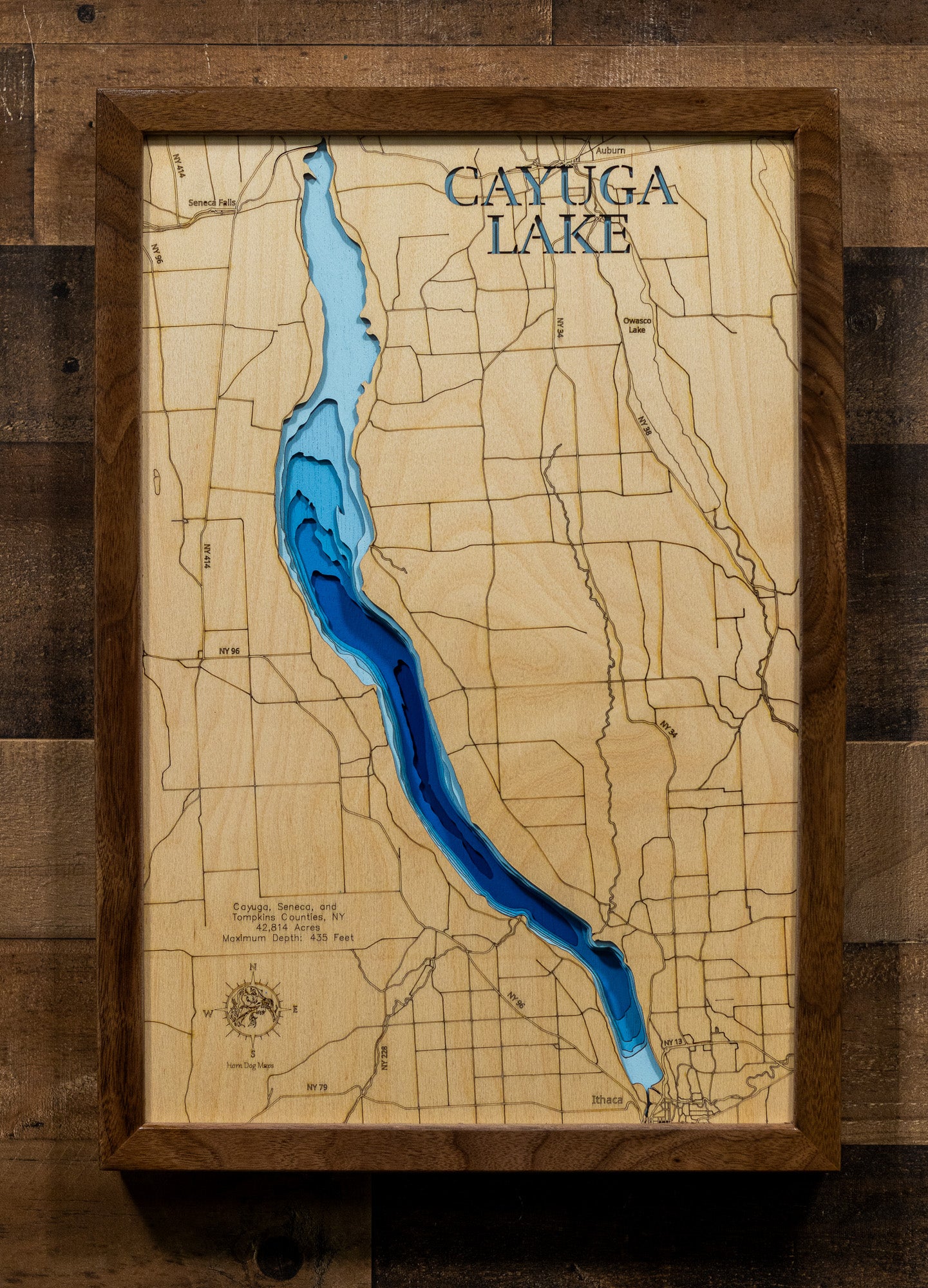 Artisanally carved wooden lake map of Cayuga Lake in Seneca, Cayuga, and Tompkins Counties, NY, highlighting bathymetry.