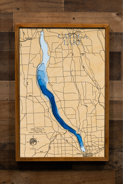 Artisanally carved wooden lake map of Cayuga Lake in Seneca, Cayuga, and Tompkins Counties, NY, highlighting bathymetry.