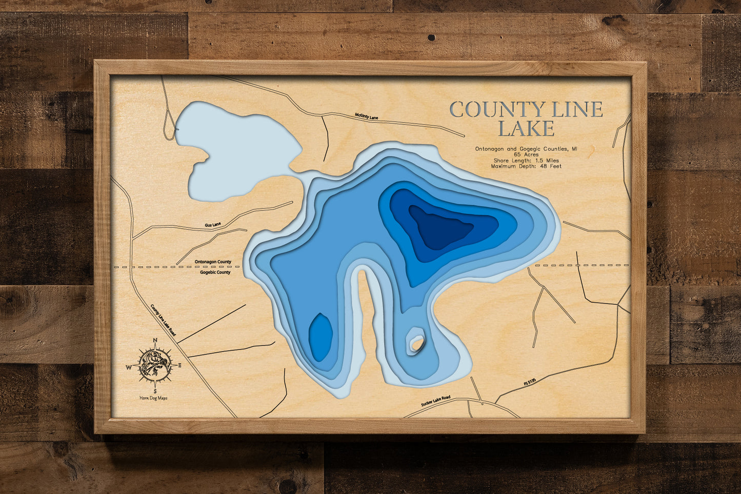 Artisanally carved wooden lake map of County Line Lake in Ontonagon and Gogebic Counties, MI, highlighting bathymetry.