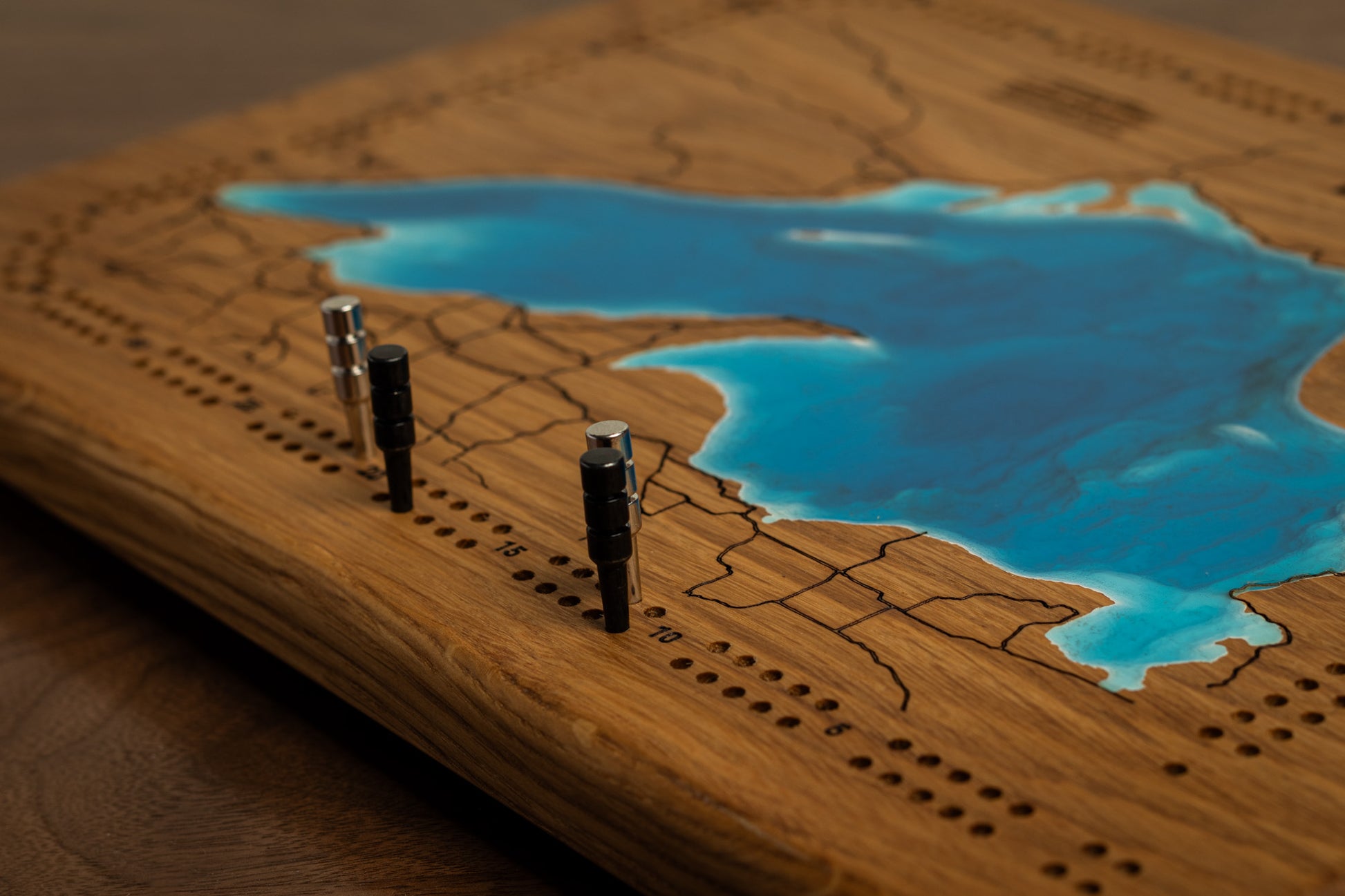 Close Up of pegs on an Oak Cribbage Board
