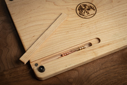 Close up of dovetail sliding peg slot on maple cribbage board.