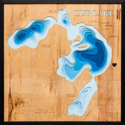 Laser-engraved relief map of Cub Lake in Hillsdale County, MI, crafted from wood with high precision.