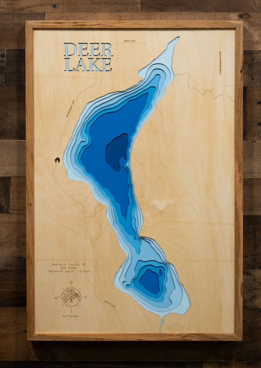A laser-cut, layered wood map of Deer Lake, Washburn County, Wisconsin, highlighting its detailed shoreline and surrounding landscape.