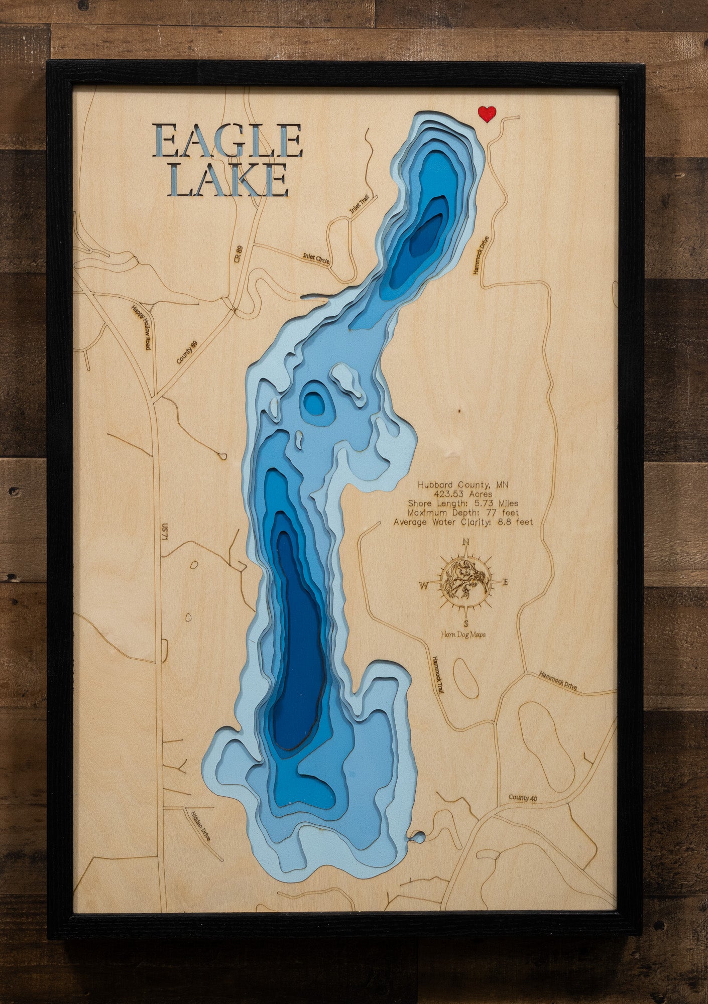 A meticulously crafted laser-cut wooden lake map of Eagle Lake in Hubbard County, Minnesota. The map features the lake’s accurate shape and detailed shoreline, with its impressive depth and clear water represented by a deep blue stain. Meticulously etched details include the unique lake shape, its shore length, and maximum depth, providing both a beautiful piece of art and a detailed, informative guide to this popular Minnesota lake.