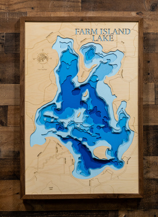 A 3D layered wooden map of Farm Island Lake, featuring layered blue and light blue depths on a natural wood background, mounted on a rustic dark wood plank wall.