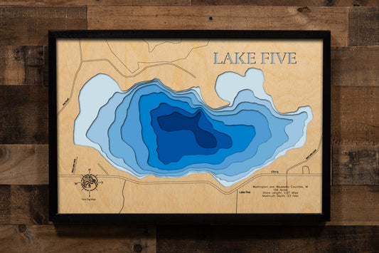 A precision laser-cut, multi-layered wooden map of Lake Five in 
Richfield, Wisconsin. The natural wood top layer captures every 
detail of the 2.07-mile shoreline, while the recessed water layers 
feature a vibrant light-to-dark blue gradient to show the 23-foot 
depth. This elegant 3D topographic art piece is a sophisticated 
home decor item, perfect for cabin walls or modern interiors 
looking for a rustic, handcrafted touch.