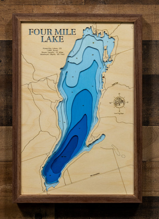 A precision laser-cut wooden map of Four Mile Lake in Ontario, 
Canada, featuring a natural wood top layer and a multi-level blue 
gradient for the water. The 3D topographic design highlights the 
15-mile shoreline and 65-foot depth in a sophisticated art piece. 
It is a rustic yet modern home decor item that perfectly captures 
the unique contours of this Kawartha Lakes reservoir for any wall.
