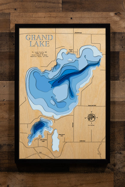 A precision laser-cut, multi-layered wooden map of Grand Lake in St. Louis County, Minnesota, just northwest of Duluth near Hermantown. The natural wood top layer captures 8 miles of shoreline in fine detail, while a light-to-dark blue gradient highlights the lake's 24-foot depth. A handcrafted statement piece for any Duluth-area lake home, cabin, or outdoor enthusiast's wall.