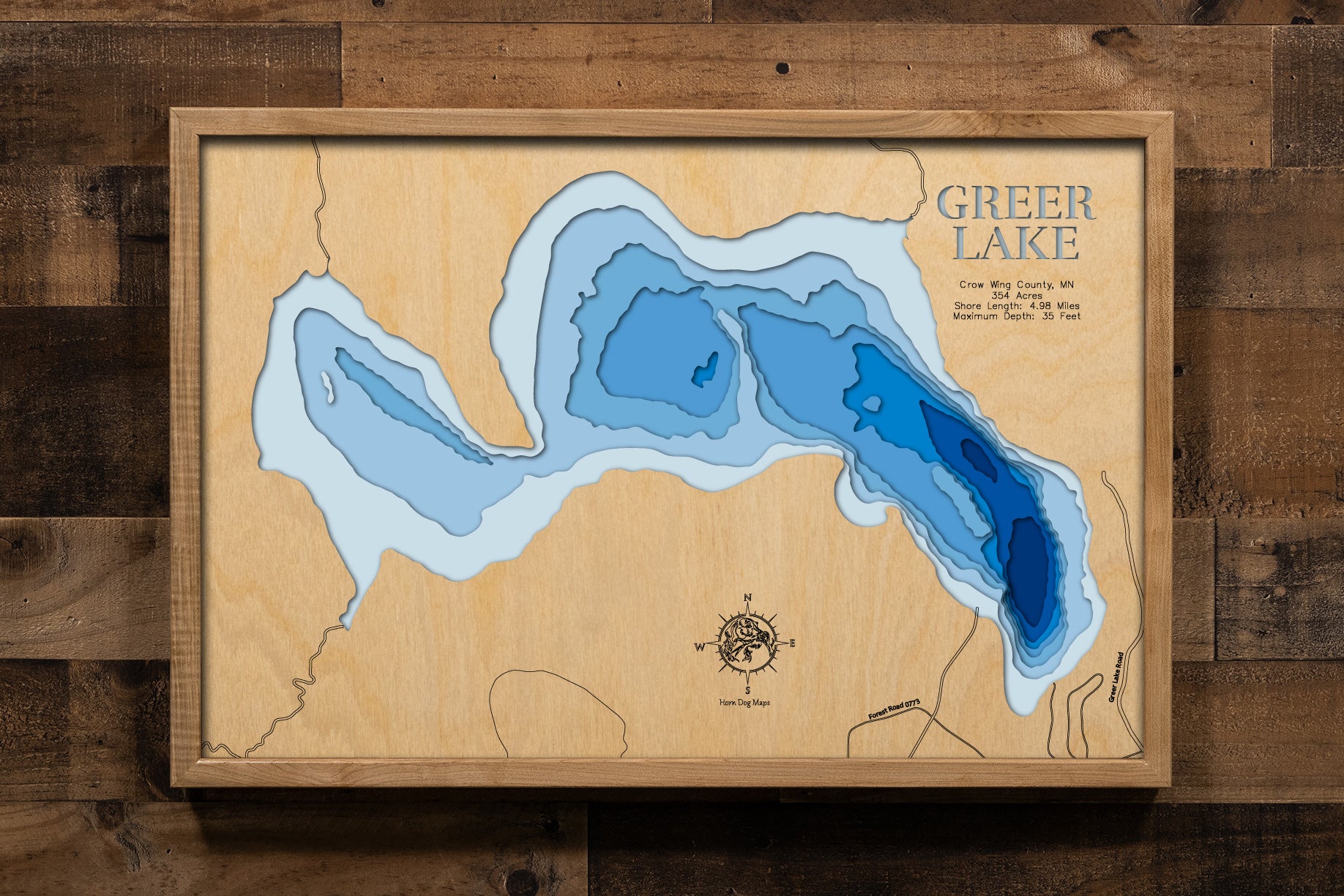 A high-quality 3D laser-cut wooden map of Greer Lake in Crow Wing 
County, Minnesota. This topographic art piece features a natural 
birch wood top layer and recessed water layers stained in a 
light-to-dark blue gradient to represent the 35-foot depth. The 
intricate 4.98-mile shoreline is meticulously detailed, making it 
a perfect gift or decor item for any Minnesota lakeside cottage 
or modern interior looking for a touch of rustic charm.
