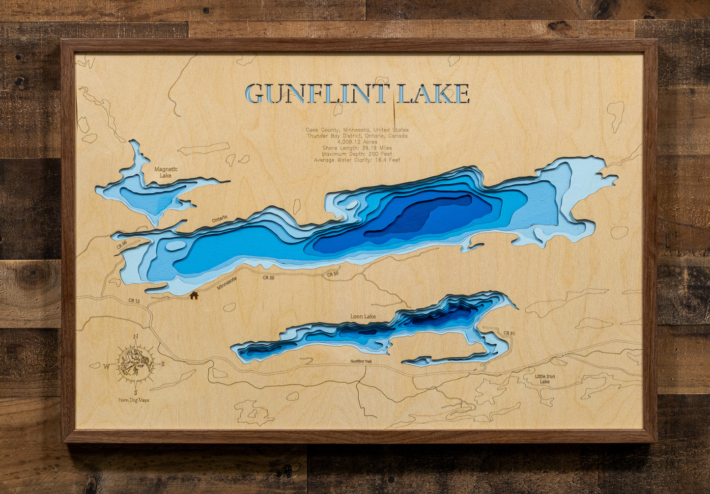Laser-engraved relief map of Gunflint Lake in Cook County, MN, Thunder Bay District, ON, crafted from wood with high precision.