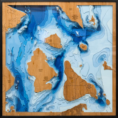 Detailed wooden relief map of Guemes Island in Washington, showcasing its natural beauty.