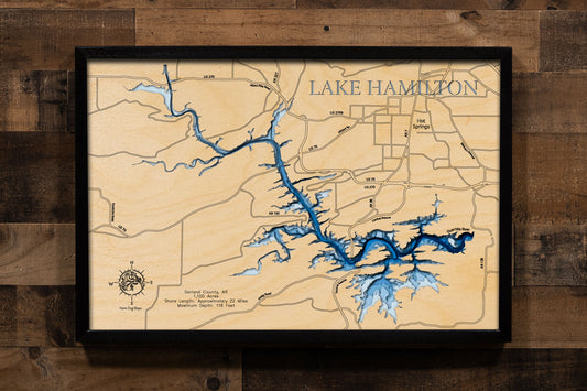 A laser-cut, layered wood map of Lake Hamilton, Arkansas, showcasing its winding shoreline and surrounding forested terrain.