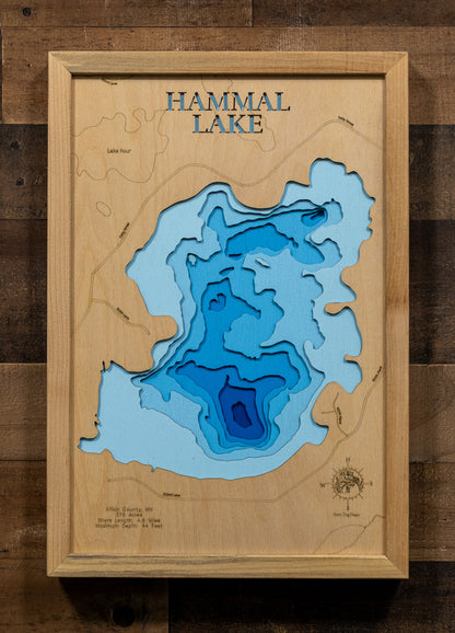 A precision laser-cut, multi-layered wooden map of Hammal Lake in 
Aitkin County, Minnesota. The natural wood top layer captures the 
intricate 4.6-mile shoreline, while the recessed water layers are 
stained with a light-to-dark blue gradient to represent the 44-foot 
depth. This elegant 3D topographic art piece serves as a 
sophisticated focal point for any cabin wall or modern home interior, 
showcasing the lake's unique geometry.