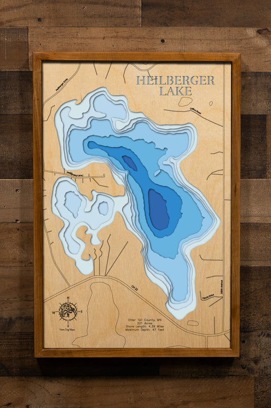 A beautifully crafted, laser-cut, multi-layered wooden map of Heilberger Lake in Otter Tail County, Minnesota, displaying the lake's 221-acre footprint with depth contours descending to 47 feet, the 4.39 miles of natural shoreline, the extensive 97-acre littoral zone ideal for fishing, and the surrounding prairie-lake landscape.