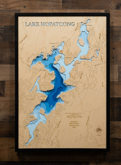 Artisanally carved wooden lake map of Lake Hopatcong in Morris and Sussex Counties, NJ, highlighting bathymetry.