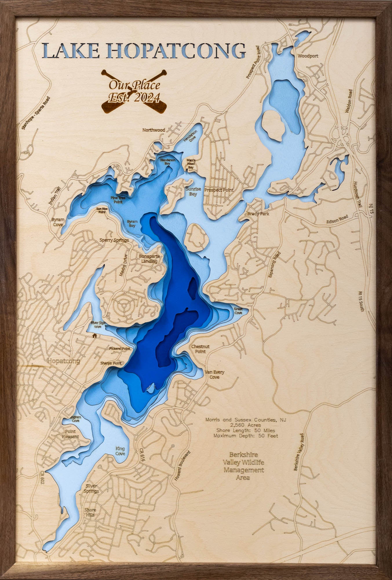 Artisanally carved wooden lake map of Lake Hopatcong in Morris and Sussex Counties, NJ, highlighting bathymetry.