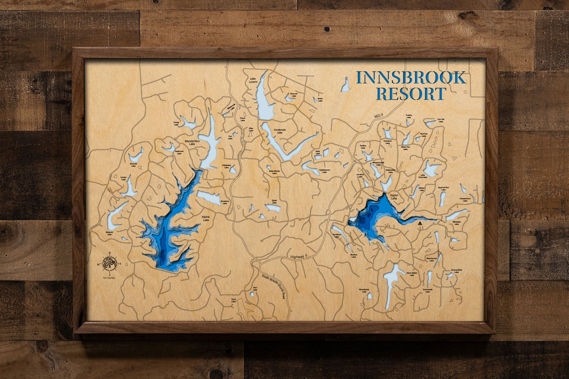 A precision laser-cut, multi-layered wooden map of Lake Aspen in Warren County, Missouri, the beloved centerpiece of Innsbrook Resort just 45 minutes west of St. Louis. The natural wood top layer captures the wooded, cove-lined shoreline of this 150-acre private lake in fine detail, while a light-to-dark blue gradient conveys its 25-foot depth. A handcrafted statement piece for any Innsbrook chalet, Missouri lake home, or outdoor enthusiast's wall.