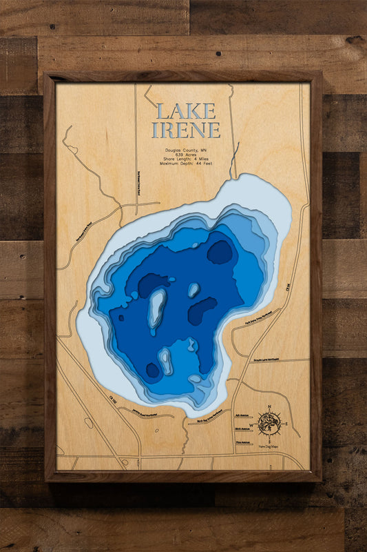 A precision laser-cut, multi-layered wooden map of Lake Irene in Douglas County, Minnesota, located alongside Lake Miltona north of Alexandria. The natural wood top layer captures 4 miles of shoreline in fine detail, while a light-to-dark blue gradient conveys the lake's 44-foot depth. A handcrafted statement piece for any Minnesota lake home, cabin, or outdoor enthusiast's wall.