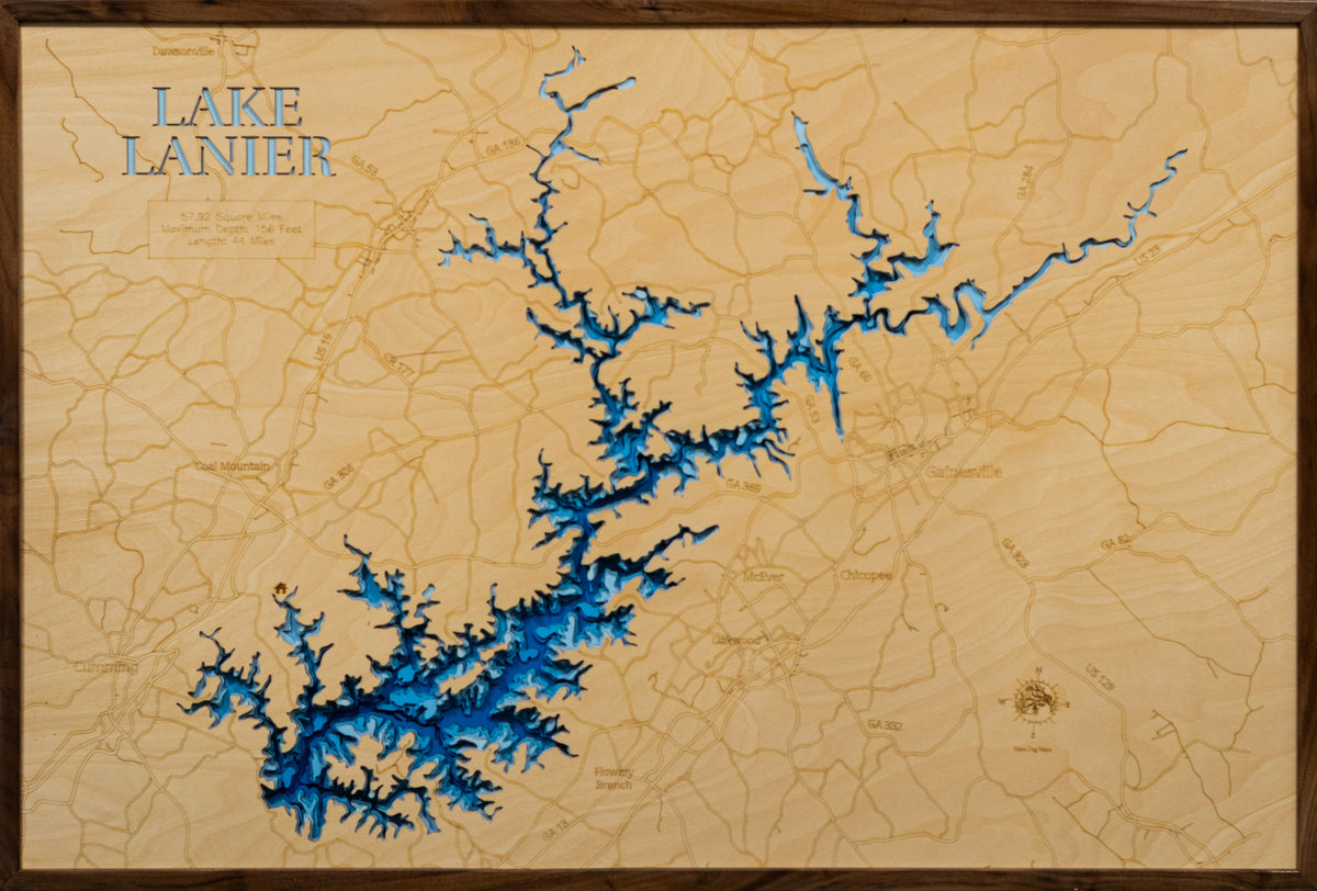A laser-cut, layered wooden map of Lake Lanier, located in Dawson, Forsyth, Gwinnett, Hall, and Lumpkin Counties, Georgia. The expansive and intricate shape of the reservoir, with its many arms and coves, is clearly visible within the northern Georgia landscape. The varying depths of the lake, reaching a maximum of 156 feet, are represented by different layers of wood, illustrating its underwater topography.