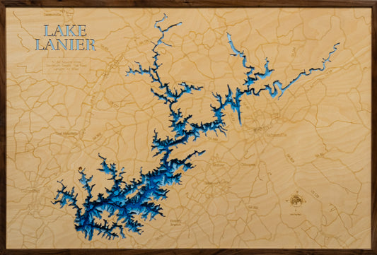 A laser-cut, layered wooden map of Lake Lanier, located in Dawson, Forsyth, Gwinnett, Hall, and Lumpkin Counties, Georgia. The expansive and intricate shape of the reservoir, with its many arms and coves, is clearly visible within the northern Georgia landscape. The varying depths of the lake, reaching a maximum of 156 feet, are represented by different layers of wood, illustrating its underwater topography.