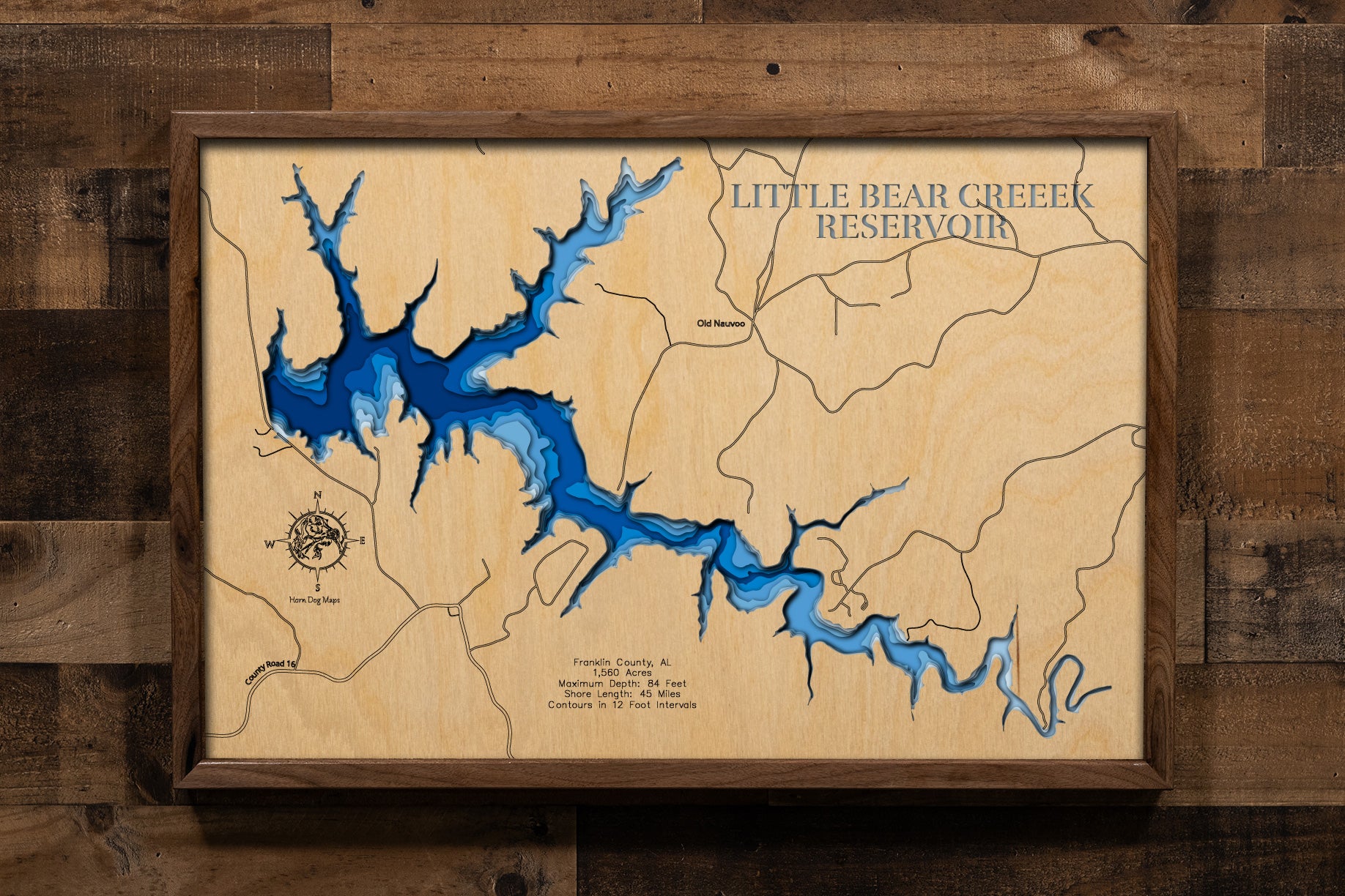 A precision laser-cut, multi-layered wooden topographic map of Little Bear Creek Reservoir in Franklin County, Alabama. The detailed design showcases the reservoir's 1,560-acre surface area extending eight miles upstream from the dam, the 45 miles of winding, forested shoreline with numerous coves and creek arms, and the clear depth contours of this pristine northwest Alabama impoundment.