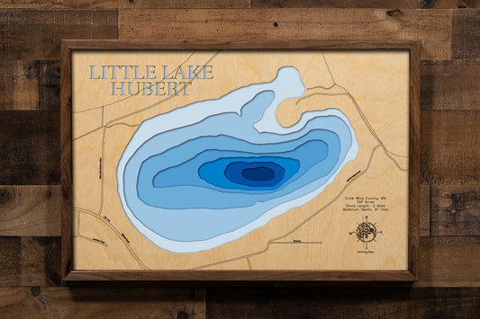 A precision laser-cut, multi-layered wooden map of Little Lake Hubert in Crow Wing County, Minnesota, a 194-acre lake near Nisswa in the heart of the Brainerd Lakes region. The natural wood top layer captures 2 miles of shoreline in fine detail, while a light-to-dark blue gradient conveys the lake's 41-foot depth. A handcrafted statement piece for any Minnesota lake cabin, home, or outdoor enthusiast's wall.