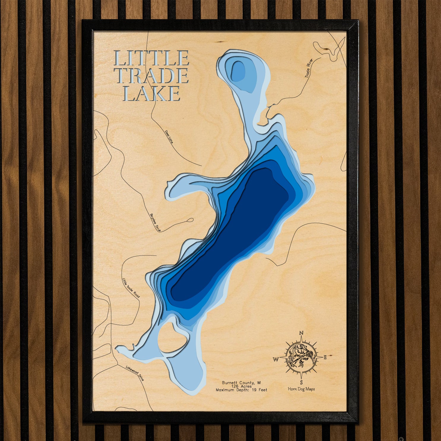 Laser-engraved relief map of Little Trade Lake in Burnett County, WI, crafted from wood with high precision.