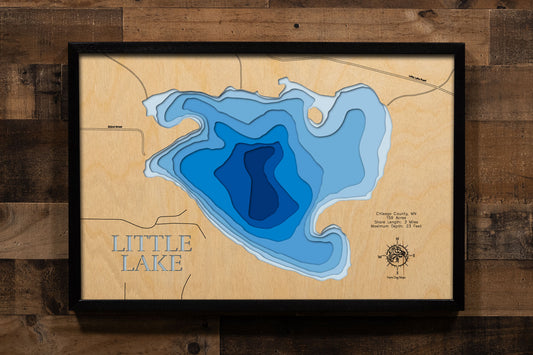 A precision laser-cut, multi-layered wooden map of Little Lake in Chisago County, Minnesota, near Center City in the heart of the Chisago Lakes region. The natural wood top layer captures 3 miles of intimate shoreline in fine detail, while a light-to-dark blue gradient conveys the lake's shallow, warmwater character. A handcrafted statement piece for any Minnesota lake home, cabin, or outdoor enthusiast's wall.