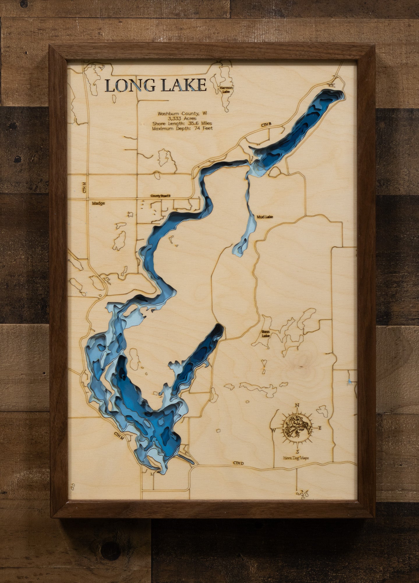 Artisanally carved wooden lake map of 3d Depth Map of Long Lake in Washburn County, WI, highlighting bathymetry.